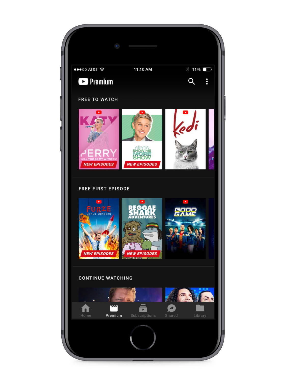 A phone with the YouTube app open browsing movies & shows